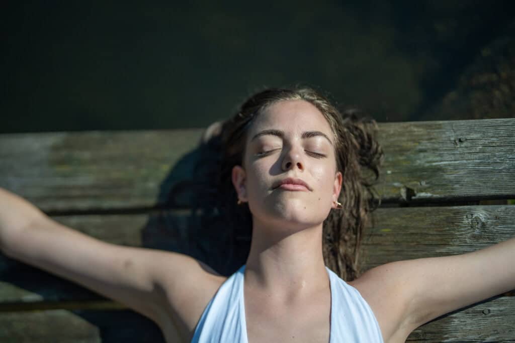 Relaxing on the footbridge of the swimming pond